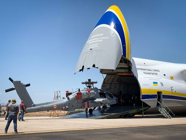 An Apache AH-64 Attack Helicopter is loaded onto an AN-124-100, which can carry up to 5 units.